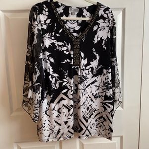 Dressy top, black/white with a subtle cream color. Poly, spandex blend, XL